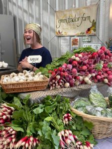 Green Tractor Farms’ Lindsay with all manner of radishes, garlic, and greens.