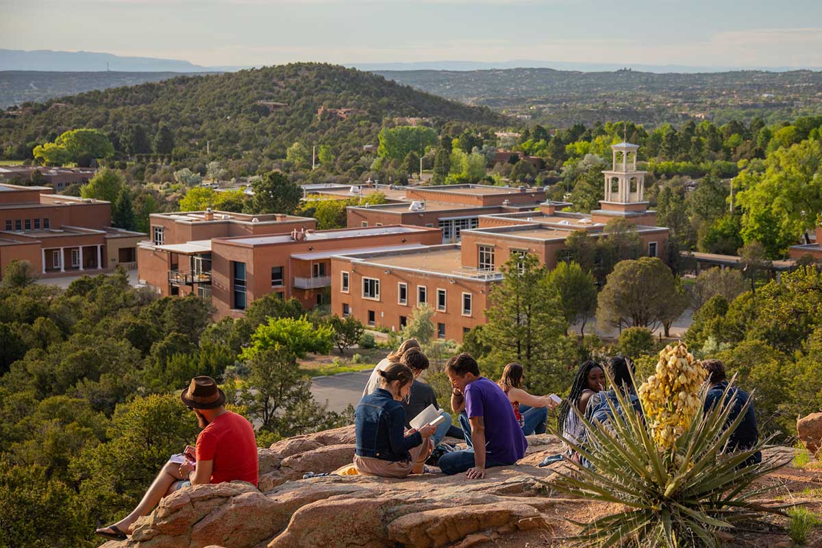 St. John's College, a private college in Santa Fe, New Mexico. Students sitting on rocks in the foreground.