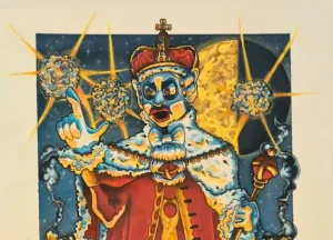 Cartoon blue-skinned monkey king in a red robe and crown, pointing with a finger, set against a bright starburst background.