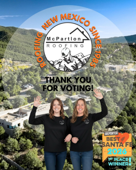 Circular NM Roofing logo overlay with two women in black shirts waving, 'Thank you for voting!' text over a townscape background.